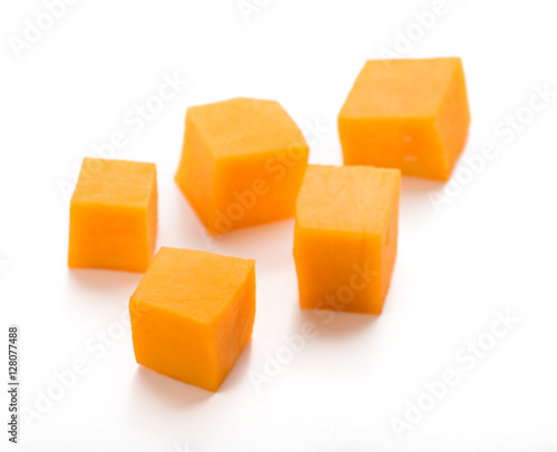 Pumpkin vegetable cube slice isolated on white background