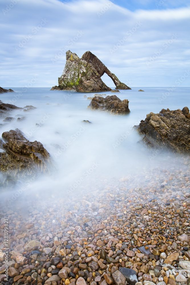 Sunset with smooth water at bow fiddle rock