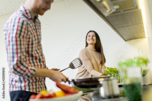 Young couple preparing meal