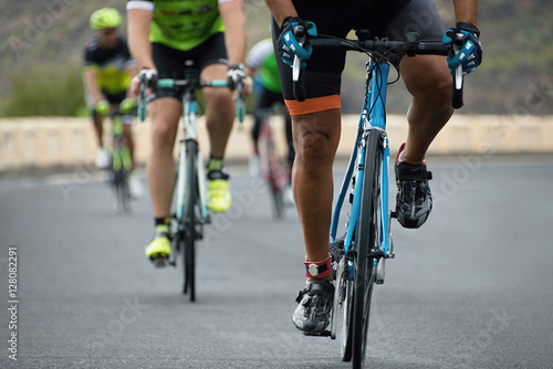Fototapeta Naklejka Na Ścianę i Meble -  Cycling competition,cyclist athletes riding a race at high speed