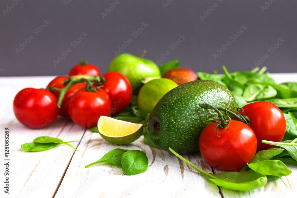 Spinach, lime, avocado, cherry tomatoes,  and apple