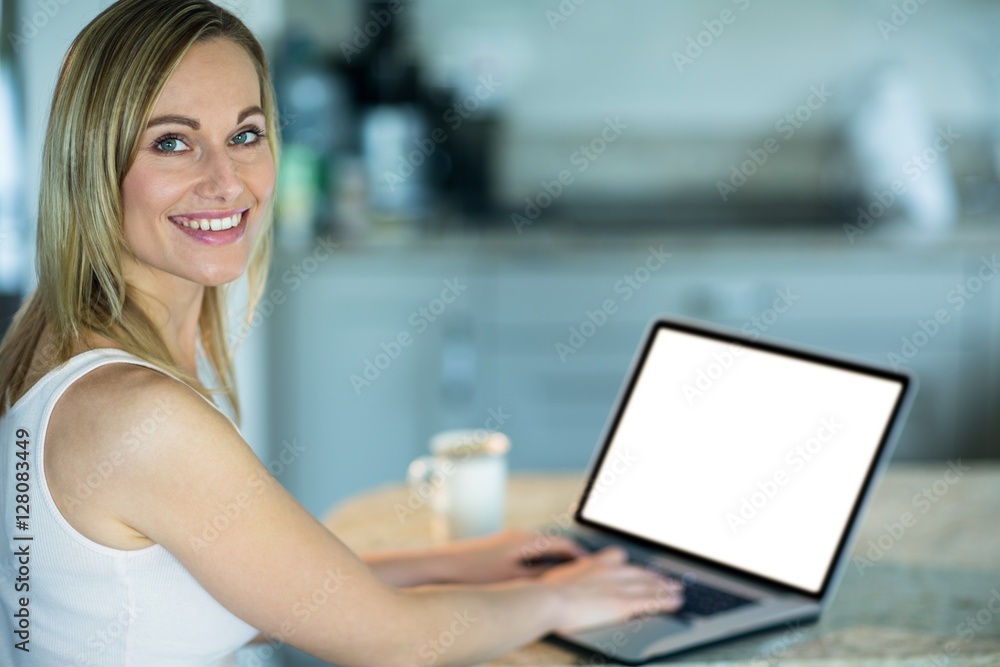 Pretty blonde woman using laptop