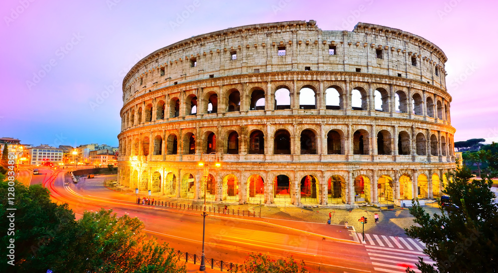 Fototapeta premium View of Colosseum at dusk in Rome, Italy