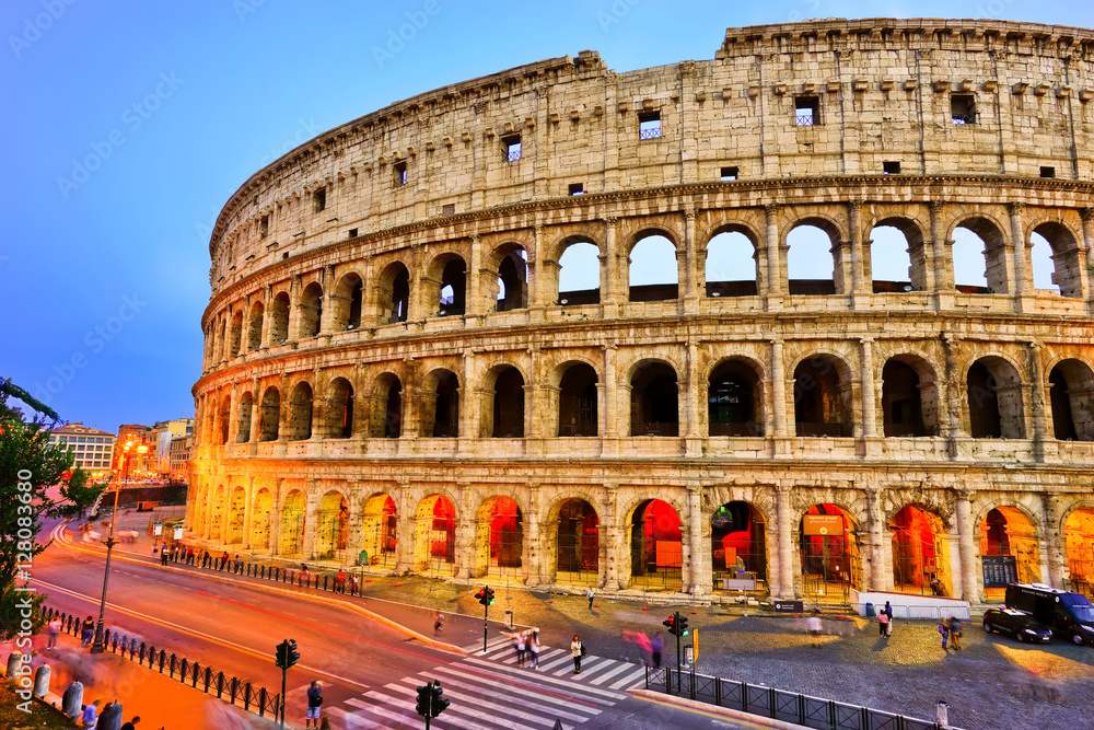 Fototapeta premium View of Colosseum at night in Rome, Italy