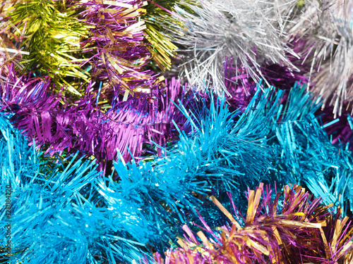 Multicolored shiny Christmas garland, festive tinsel background