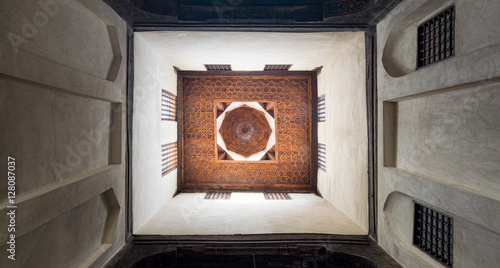 Ceiling of one of the rooms of El Sehemy house, an old historic Ottoman era house in Cairo, originally built in 1648, with interleaved wooden windows (Mashrabiya) photo