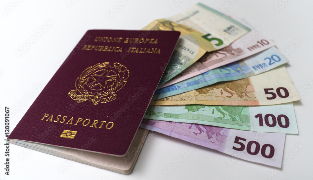 Italian passport with euro banknotes of 5, 10, 20, 50, 100 and 200 EUR denominations on white background Italian passport with euro banknotes of 5, 10, 20, 50, 100 and 200 EUR denominations on white background