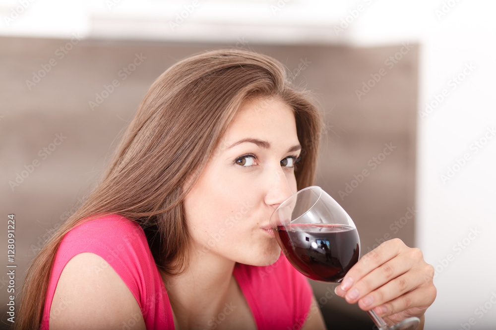 Portrait of a young girl and red wine