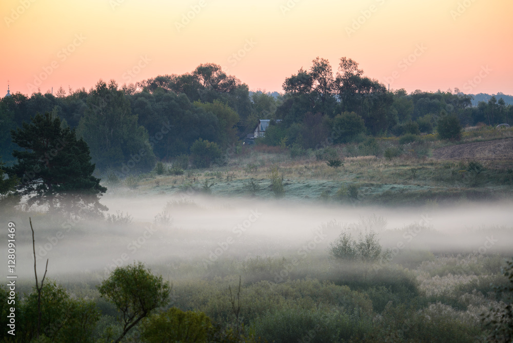 Foggy sunrise on the banks of a river in Polesie