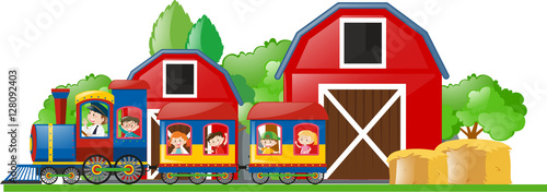 Children riding on the train to the farm
