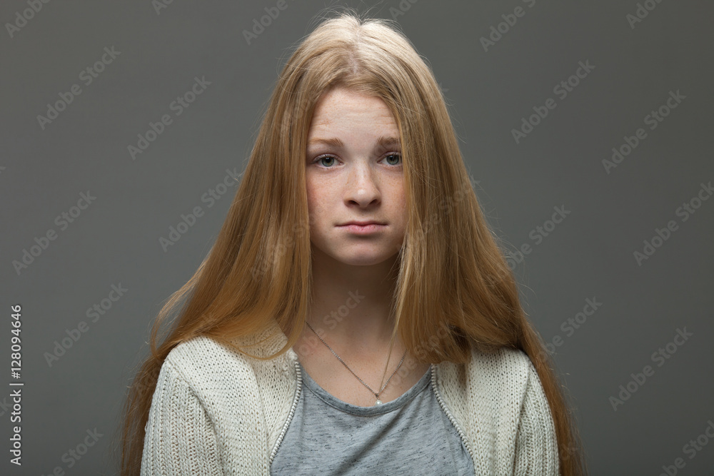 Human face expressions and emotions. Portrait of young adorable redhead woman with pouting lips in cozy shirt looking confused. Human face expressions and emotions. Portrait of young adorable redhead woman with pouting lips in cozy shirt looking confused.