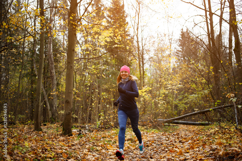 Slender woman running in park Slender woman running in park