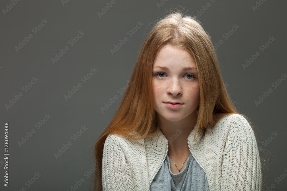 Human face expressions and emotions. Portrait of young adorable redhead woman in cozy shirt looking cute and calm. Human face expressions and emotions. Portrait of young adorable redhead woman in cozy shirt looking cute and calm.