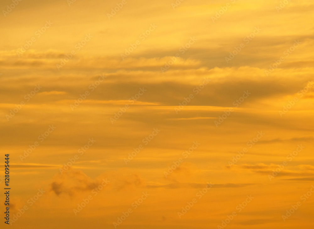 Breathtaking golden gradation of the cloudy sunset sky in Northern Thailand 