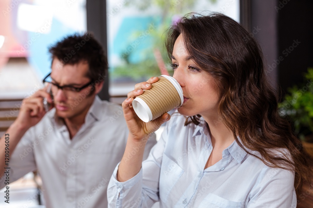 People using smartphone and drinking coffee People using smartphone and drinking coffee