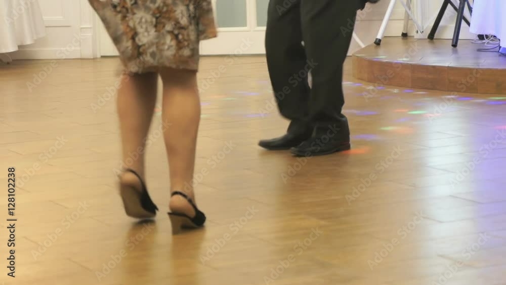 Woman and man dancing at a wedding indoors Woman and man dancing at a wedding indoors