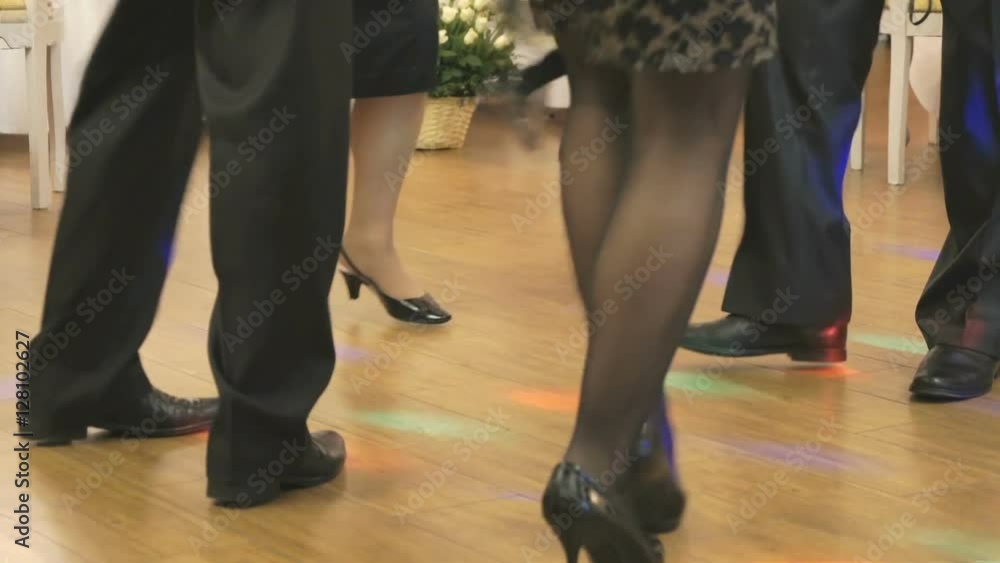 Women's and men feet in moving close up Women's and men feet in moving close up
