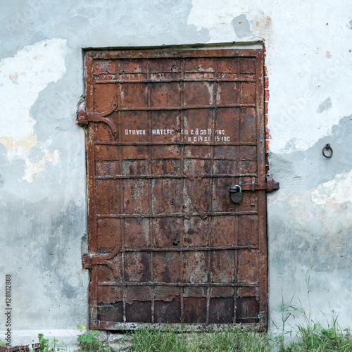 Old rusty door of abandoned storage