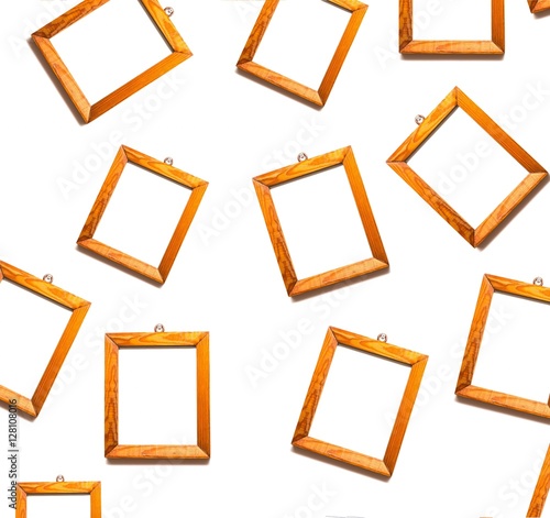 Wooden frames on white wall. Many frames