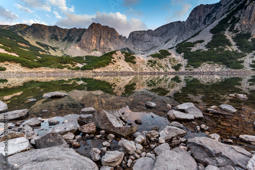Sunset with colored in red clouds of Sinanitsa peak and the lake, Pirin Mountain, Bulgaria