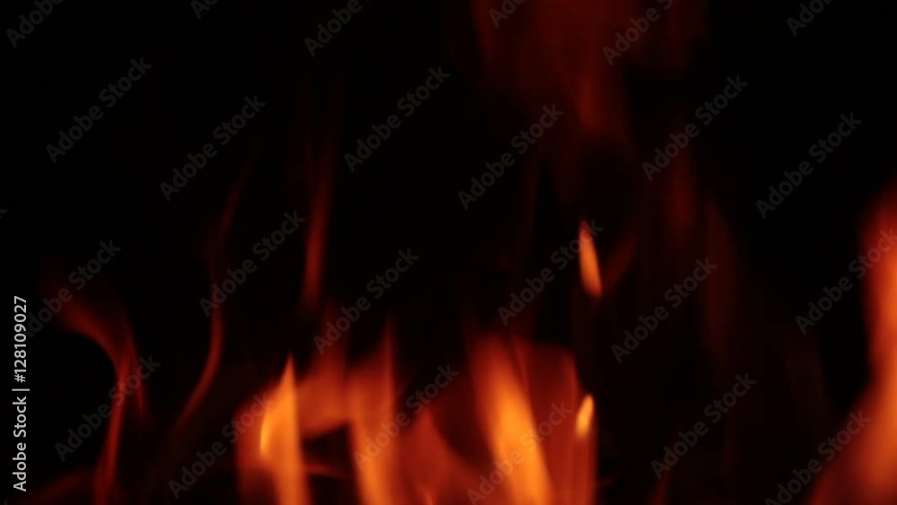 Flames of fire in a fireplace, with tones Orange and black. Flames of fire in a fireplace, with tones Orange and black.
