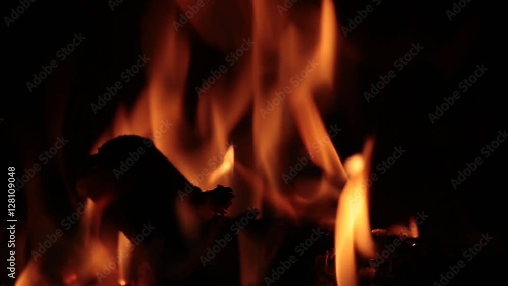 Flames of fire in a fireplace, with tones Orange and black. Flames of fire in a fireplace, with tones Orange and black.