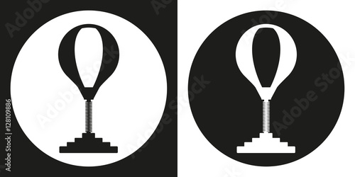 Punching bag icon. Silhouette punching bag on a black and white background. Sports Equipment. Vector Illustration.