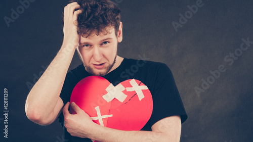 Unhappy man with broken heart. photo