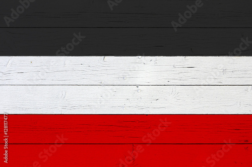 Flag of the German Empire on wooden background