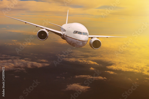 traveling plane flying over sun rising sky