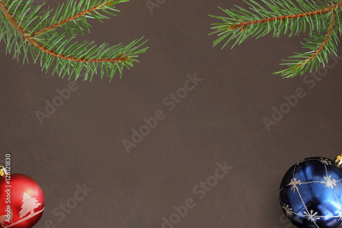 red and blue ball on dark background with Christmas fir branch photo