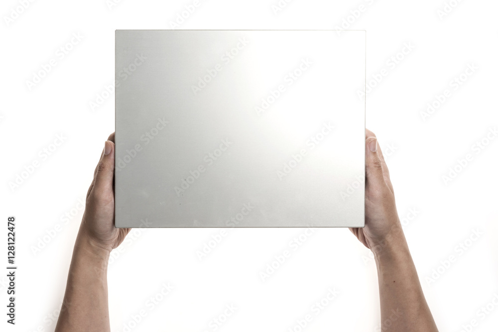 Two hands hold a empty(blank) silver(stainless) gift box isolated white Two hands hold a empty(blank) silver(stainless) gift box isolated white