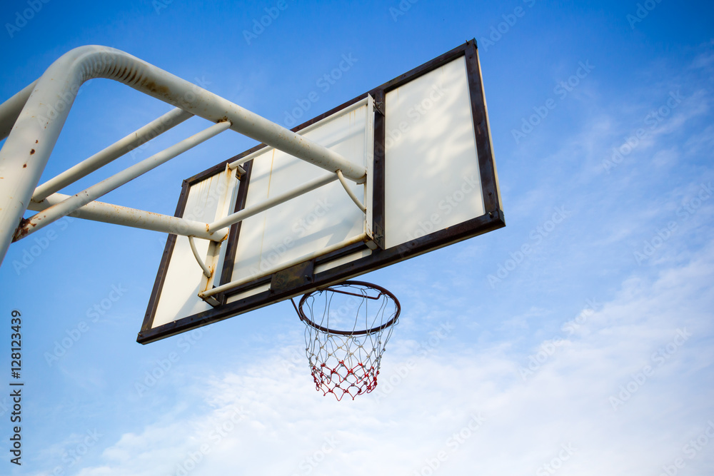 Basketball hoop and blue sky and cloud background