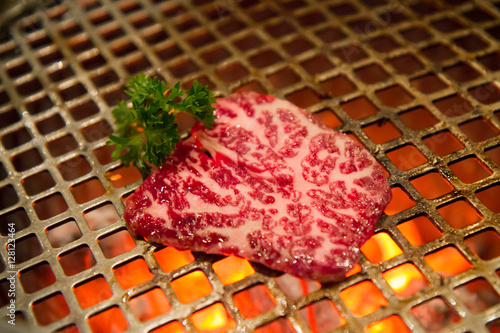 high quality a4 or a5 beef on steel grill in yakiniku restaurant