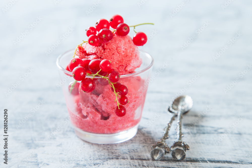 ice cream with berries in a glass on a table, selective focus ice cream with berries in a glass on a table, selective focus
