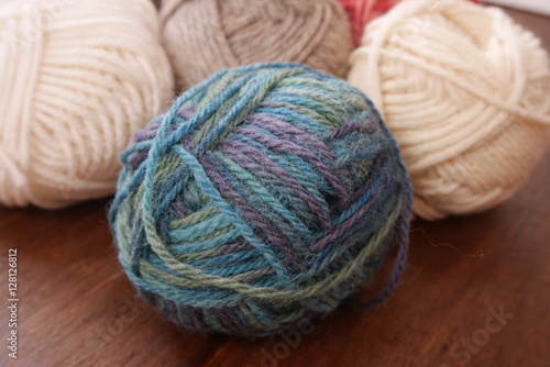 Colorful woolen balls with knitting needles
