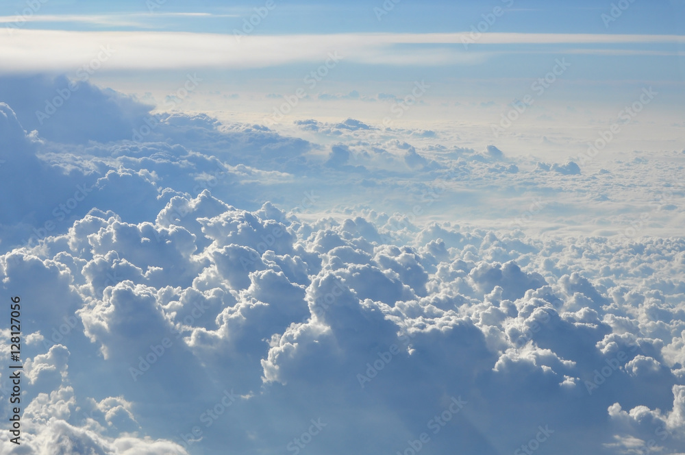 Sky scenery. Aerial view over the cumulus clouds on a sunny day. Sky scenery. Aerial view over the cumulus clouds on a sunny day.
