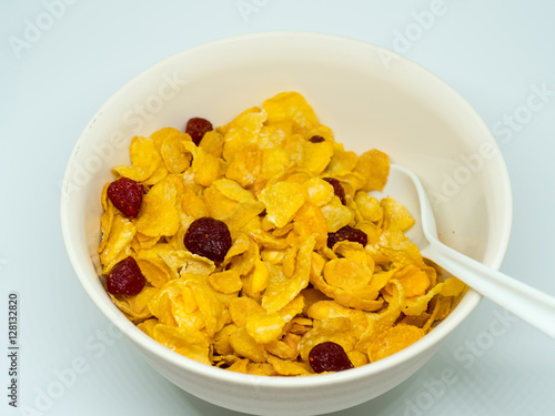 The breakfast cereal topped with dried fruit.