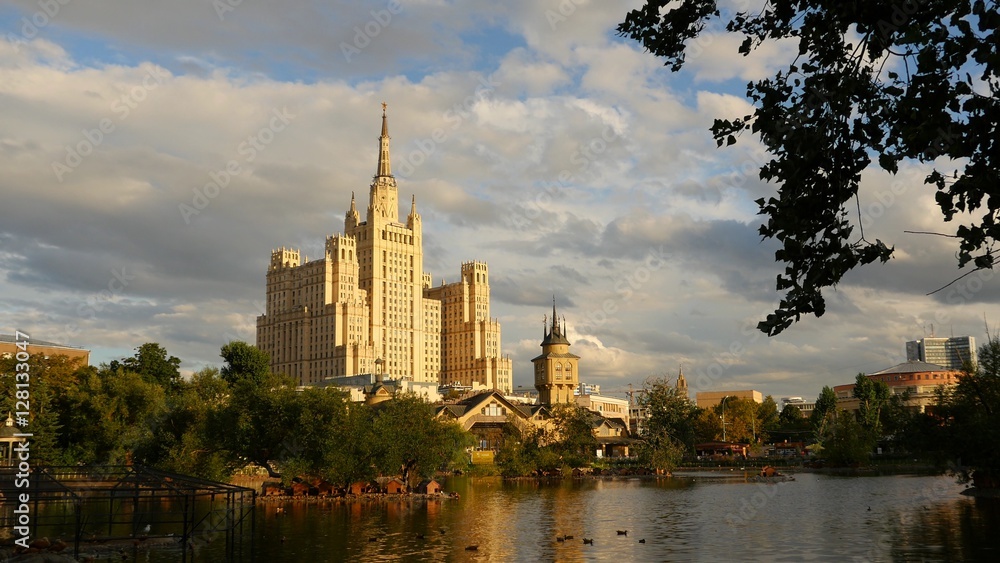 Kudrinskaya Square Building is one of seven Stalinist skyscrapers. Against the backdrop  the lake. Evening.