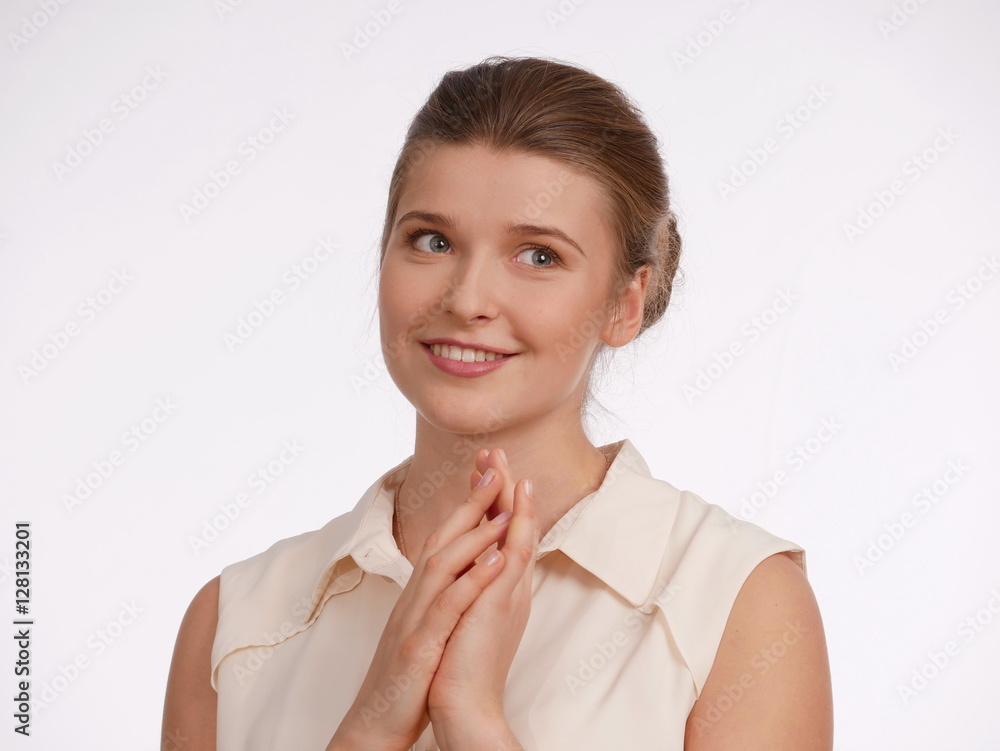 Beautiful woman posing in studio on light background. Beautiful woman posing in studio on light background.