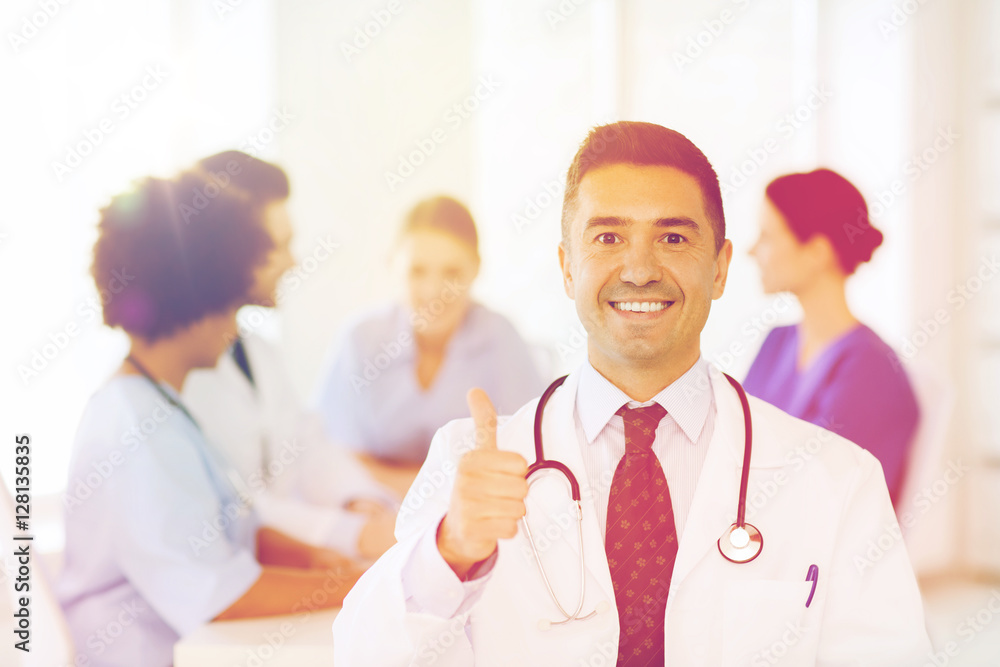 happy doctor over group of medics at hospital happy doctor over group of medics at hospital