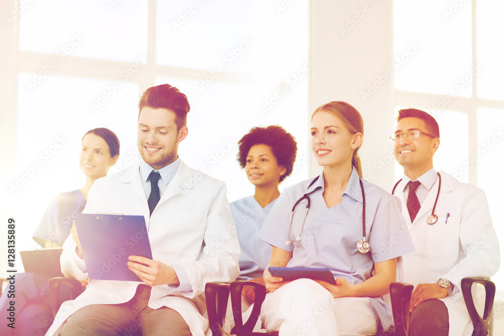 group of happy doctors on seminar at hospital group of happy doctors on seminar at hospital