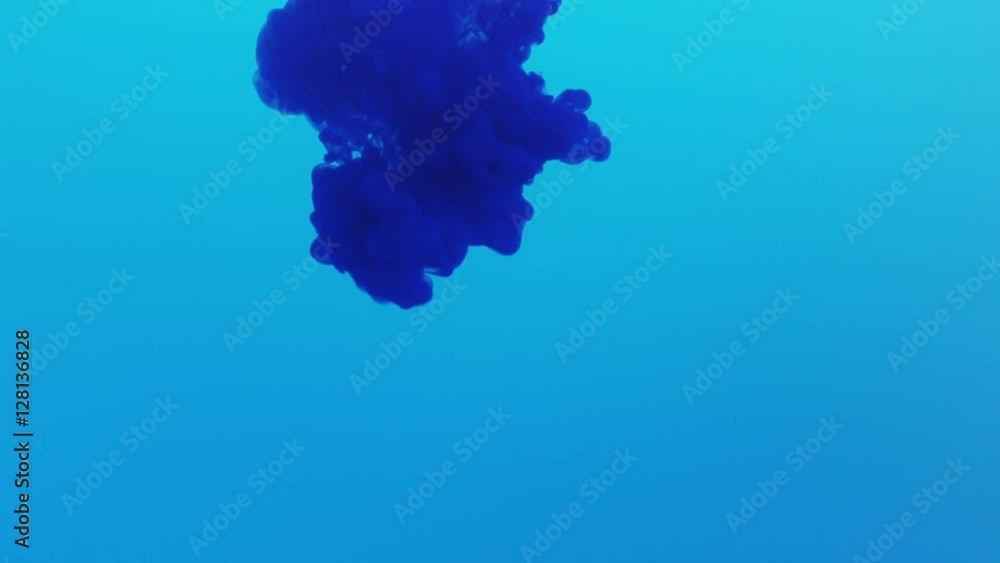 blue ink poured in blue colour water in slow motion, 180fps prores footage blue ink poured in blue colour water in slow motion, 180fps prores footage