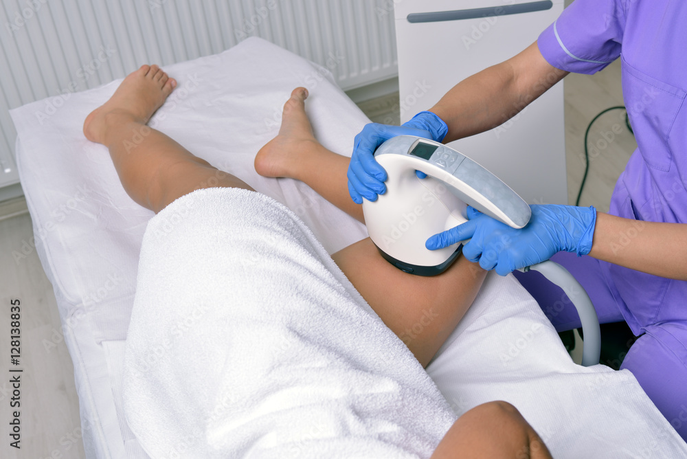 Beauty treatment of a young woman in specialized clinic. Body shaper Beauty treatment of a young woman in specialized clinic. Body shaper
