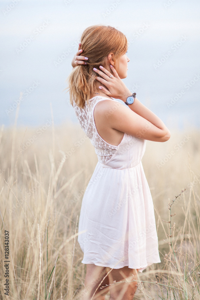 Portrait of the beautiful girl on nature