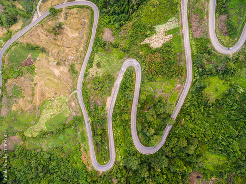 Aerial view of crooked path of road on the mountain, Shot from d