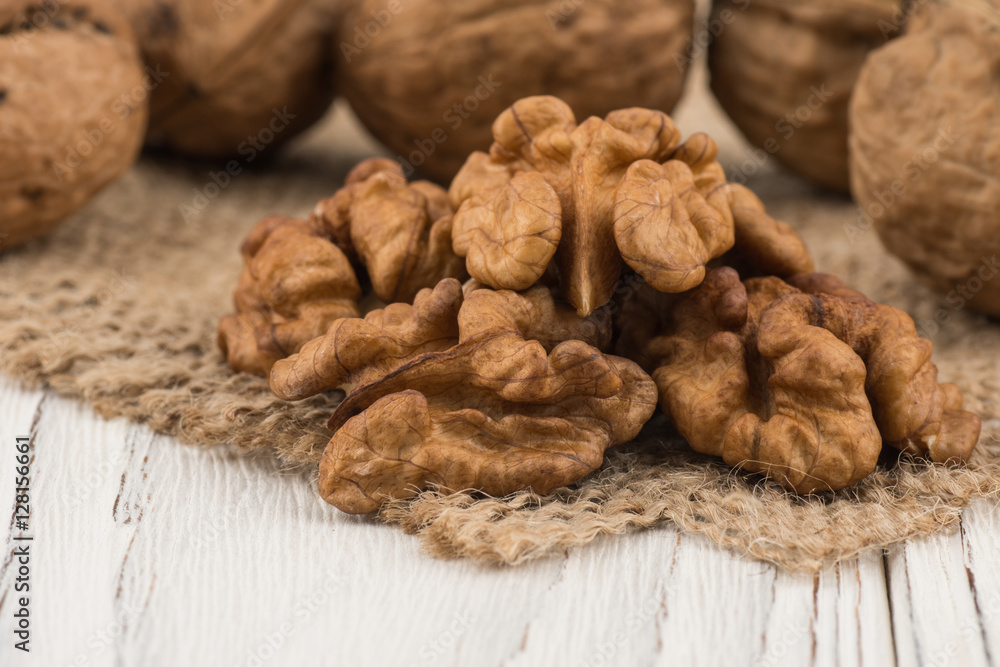 Walnut closeup on an old white table. Walnut closeup on an old white table.