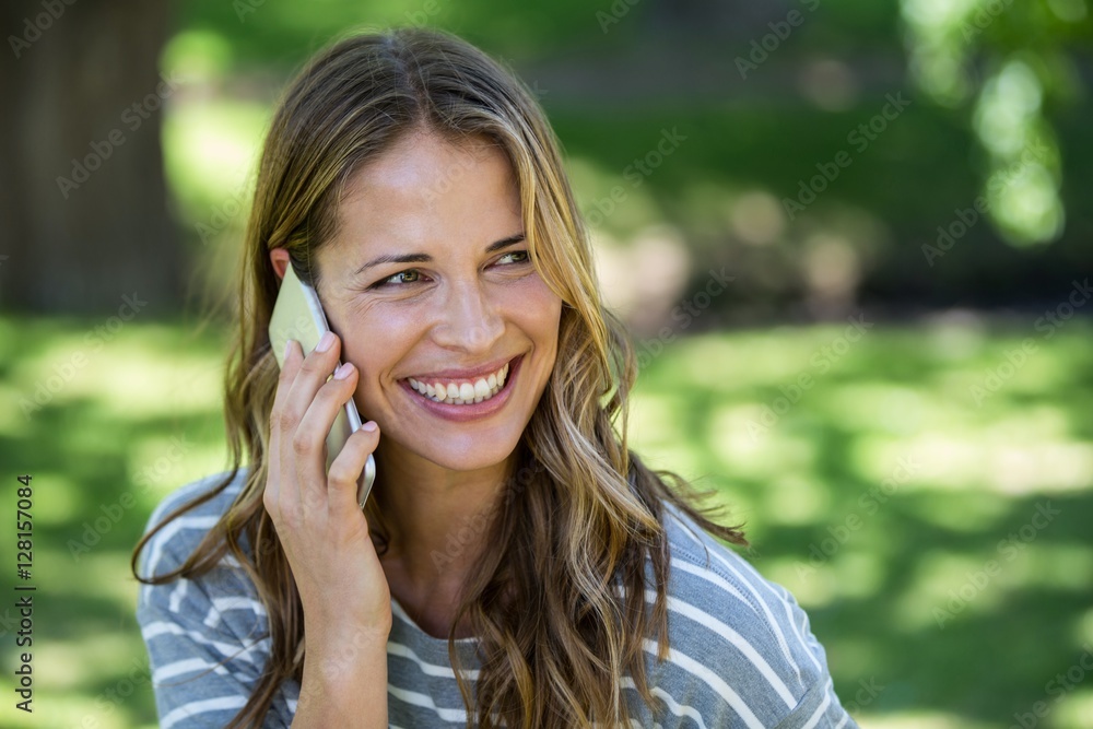 Smiling woman making a phone call