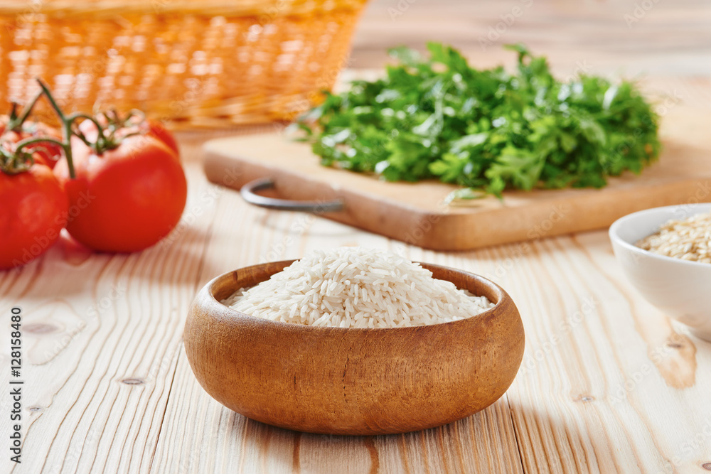 Basmati rice and brown rice on spoon Basmati rice and brown rice on spoon