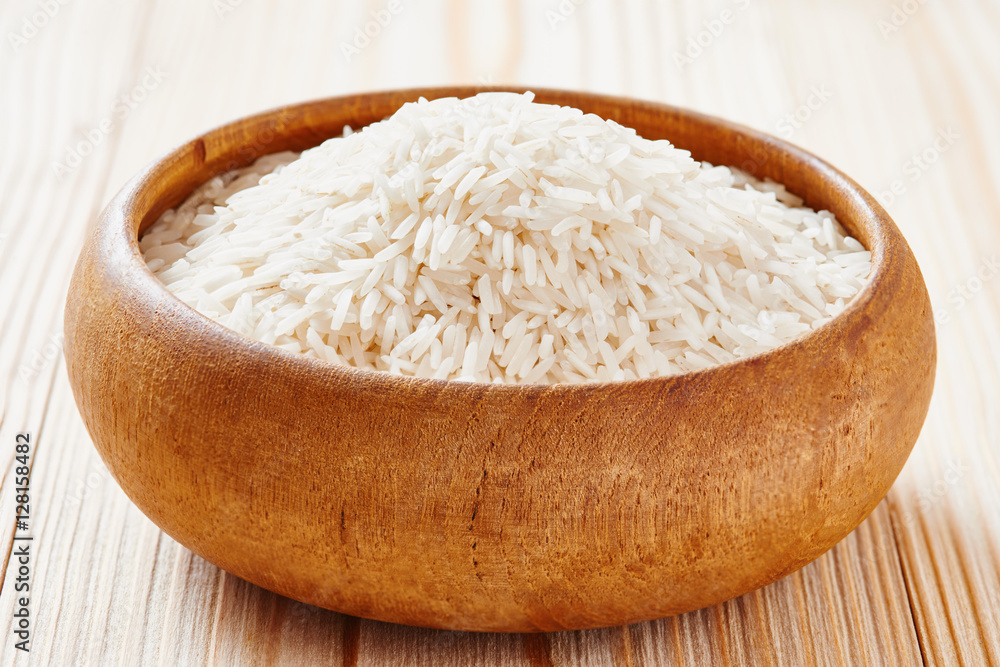 Basmati rice and brown rice on spoon